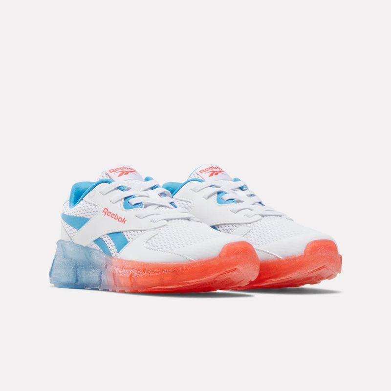 Tenis-reebok-para-niño-Zig-N-Glow-2-Elastic-Lace-para-correr-color-blanco.-Lateral-Interna-Izquierda